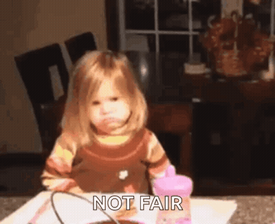A Little Girl Is Sitting At A Table With A Pink Cup And The Words `` Not Fair '' . GIF