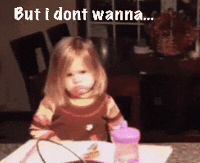 A Little Girl Is Sitting At A Table With The Words But I Dont Wanna Written Above Her GIF