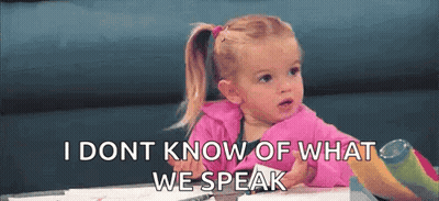 A Little Girl Is Sitting At A Table With The Words `` I Don T Know What We Speak '' Written On The Screen . GIF