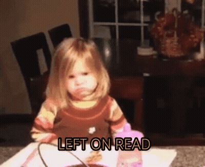 A Little Girl Is Sitting At A Table With The Words Left On Read Written Above Her GIF