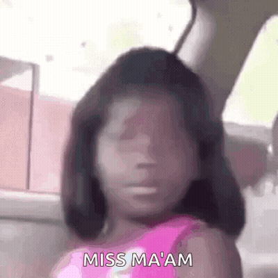 A Little Girl Is Sitting In A Car With Her Eyes Closed And Making A Funny Face . GIF
