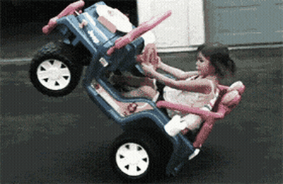 A Little Girl Is Sitting In A Jeep Toy Car GIF