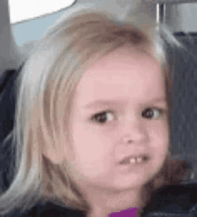 A Little Girl Is Sitting In The Back Seat Of A Car And Making A Funny Face . GIF