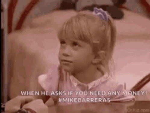 A Little Girl Is Sitting On A Bed With A Person Holding Her Hand . GIF