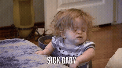 A Little Girl Is Sitting On A Couch And Making A Funny Face . GIF