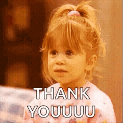A Little Girl Is Sitting On A Couch And Saying Thank You . GIF