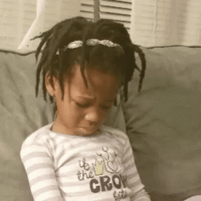 A Little Girl Is Sitting On A Couch Wearing A Shirt That Says " It 'S The Crow Bites " GIF