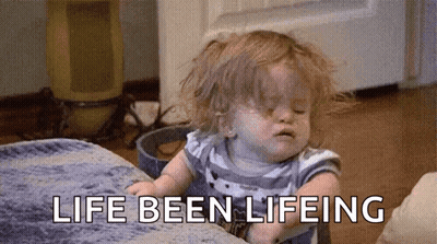 A Little Girl Is Sitting On A Couch With The Words `` Life Been Lifeing '' Written On The Floor . GIF