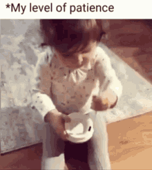 A Little Girl Is Sitting On A Potty Holding A Cup Of Coffee . GIF