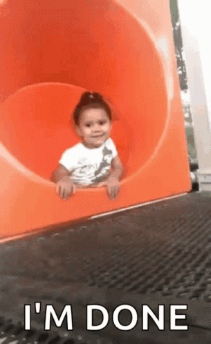 A Little Girl Is Sitting On An Orange Slide With The Words " I 'M Done " Above Her GIF