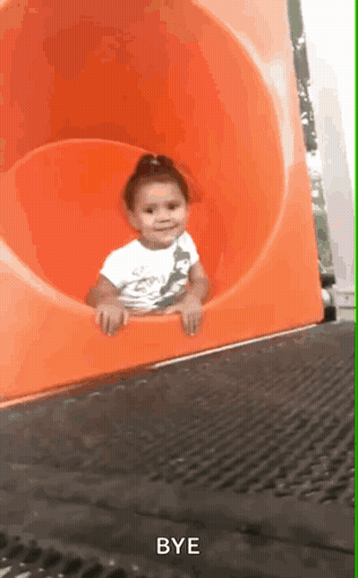 A Little Girl Is Sliding Down An Orange Slide With The Words Bye Written On The Bottom GIF