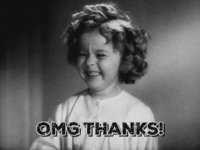 A Little Girl Is Smiling In A Black And White Photo And Saying `` Omg Thanks '' . GIF