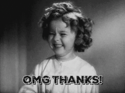 A Little Girl Is Smiling In A Black And White Photo With The Words `` Omg Thanks '' . GIF