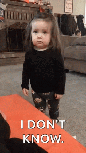 A Little Girl Is Standing In A Living Room And Saying `` I Do N't Know . '' GIF