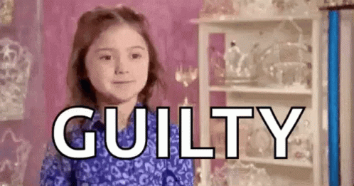 A Little Girl Is Standing In Front Of A Shelf With The Word Guilty Written In Front Of Her . GIF