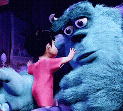 A Little Girl Is Standing Next To A Monster From The Movie Monsters Inc GIF