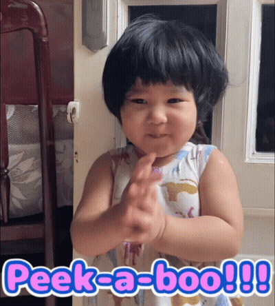 A Little Girl Making A Funny Face With The Words Peek-A-Boo Written Below Her GIF