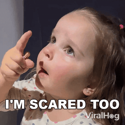 A Little Girl Says I 'M Scared Too While Holding A Peanut GIF