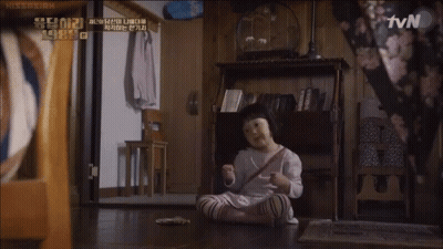 A Little Girl Sits On The Floor In Front Of A Tv Screen GIF