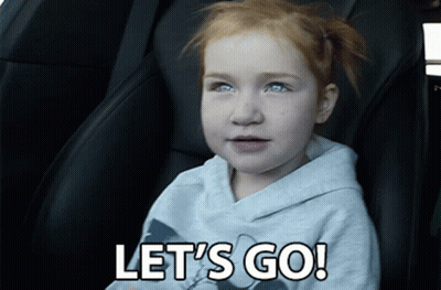 A Little Girl Sitting In A Car With The Words Let 'S Go GIF