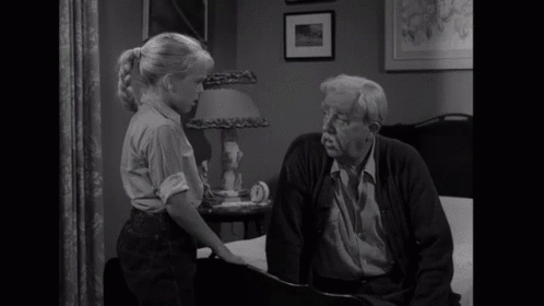 A Little Girl Talking To An Older Man With The Word No Visible In Yellow GIF
