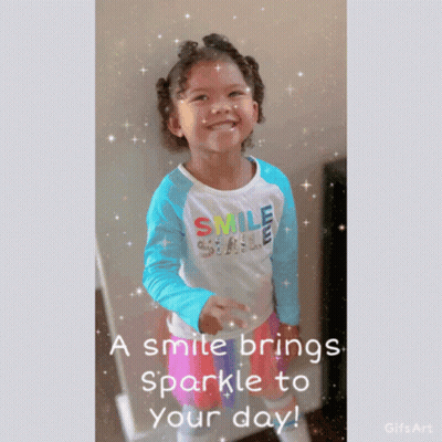 A Little Girl Wearing A Blue And White Smile Shirt GIF