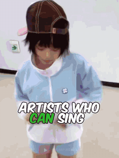 A Little Girl Wearing A Hat And A Blue Jacket With The Words Artists Who Can Sing Above Her GIF