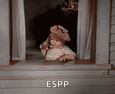 A Little Girl Wearing A Hat Is Looking Out Of A Window And Says Espp . GIF