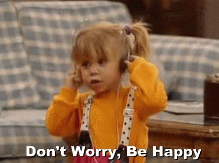 A Little Girl Wearing Headphones Is Talking On A Cell Phone And Says `` Don 'T Worry , Be Happy '' . GIF