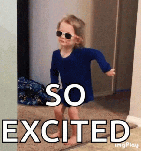 A Little Girl Wearing Sunglasses And A Blue Shirt Is Excited GIF