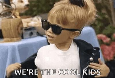 A Little Girl Wearing Sunglasses And A Leather Jacket . GIF