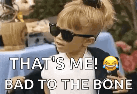 A Little Girl Wearing Sunglasses And A Ponytail Is Saying `` That 'S Me ! Bad To The Bone `` . GIF