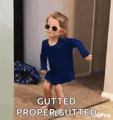 A Little Girl Wearing Sunglasses Is Dancing And Says Gutted Propergutted GIF