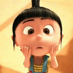 A Little Girl With A Bun On Her Head Is Making A Surprised Face GIF