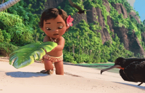 A Little Girl With A Flower In Her Hair Is Standing On A Beach Holding A Green Object GIF