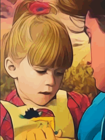A Little Girl With A Red Flower In Her Hair Is Looking Down At Something GIF