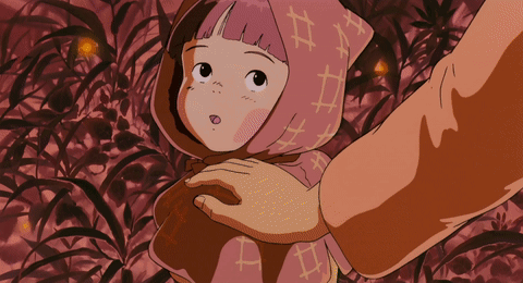 A Little Girl With A Scarf On Her Head Has The Letter A On It GIF