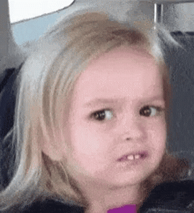 A Little Girl With Blonde Hair Is Making A Funny Face In A Car Seat . GIF