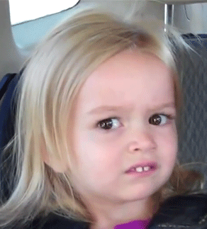 A Little Girl With Blonde Hair Is Making A Serious Face GIF