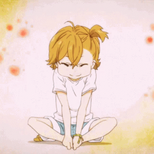 A Little Girl With Blonde Hair Is Sitting In A Lotus Position With Her Legs Crossed GIF