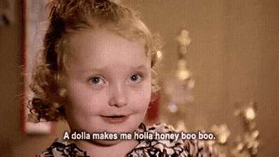 A Little Girl With Curly Hair Is Smiling And Says `` A Dolla Makes Me Holla Honey Boo Boo . '' GIF