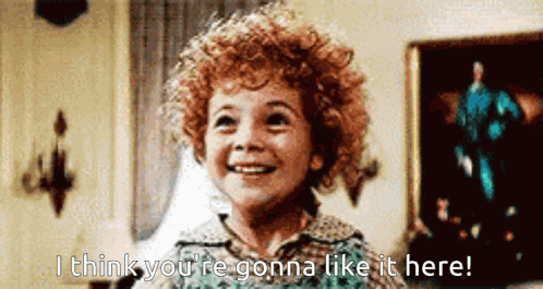 A Little Girl With Curly Hair Smiles And Says I Think You 'Re Gonna Like It Here GIF