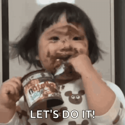 A Little Girl With Her Face Covered In Chocolate Is Holding A Can Of Nutella And Eating It . GIF