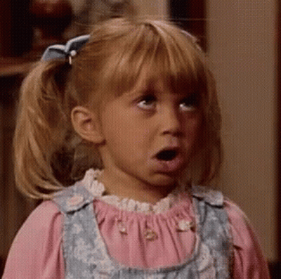 A Little Girl With Pigtails And A Bow On Her Hair Looks Surprised GIF
