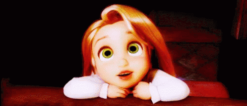 A Little Girl With Red Hair And Green Eyes Is Sitting At A Table With Her Head On Her Hands . GIF