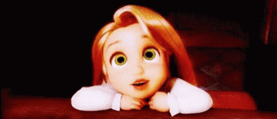 A Little Girl With Red Hair And Green Eyes Is Sitting At A Table With Her Head On Her Hands . GIF