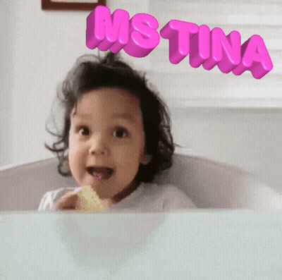 A Little Girl With The Name Justina Written On Her Head GIF