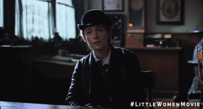 A Little Women Movie Poster With A Woman In A Suit GIF