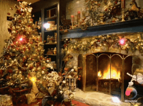 A Living Room Decorated For Christmas With A Christmas Tree And Fireplace GIF