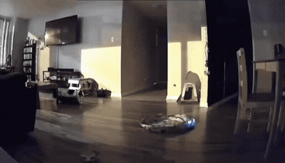 A Living Room With A Couch And A Television GIF